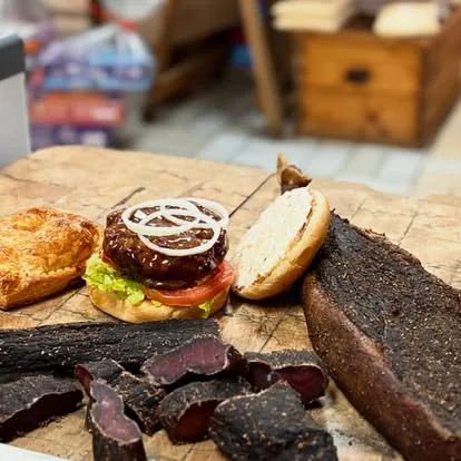 Linga Lapa burger beside sliced biltong