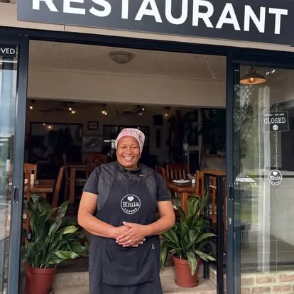 Elula Coffee & Café team member at the entrance